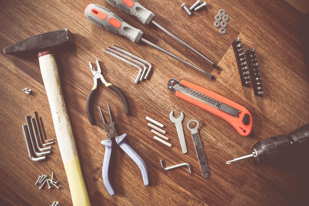 Various tools on a wooden table.